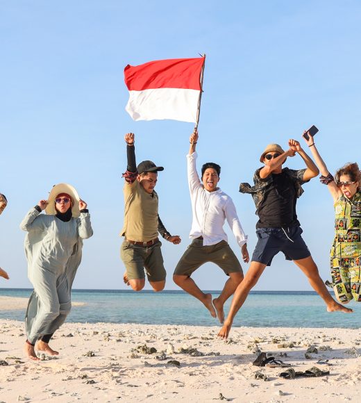 Group of people jumping together on the beach for celebrating Indonesia Independence day Group of people jumping together on the beach for celebrating Indonesia Independence day